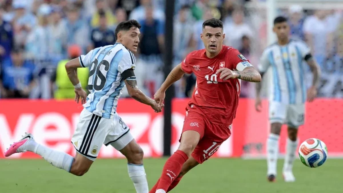 Argentinian and Swiss players competing for the ball Argentinian and Swiss players competing for the ball
