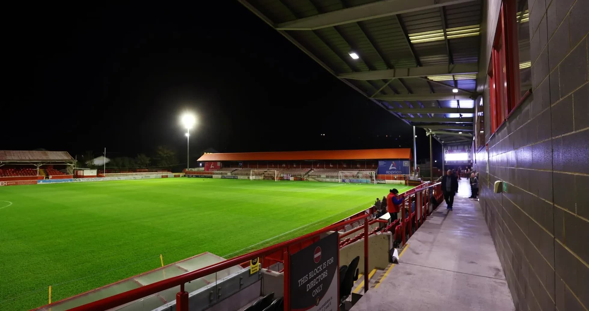 View of football stadium at night with empty field View of football stadium at night with empty field