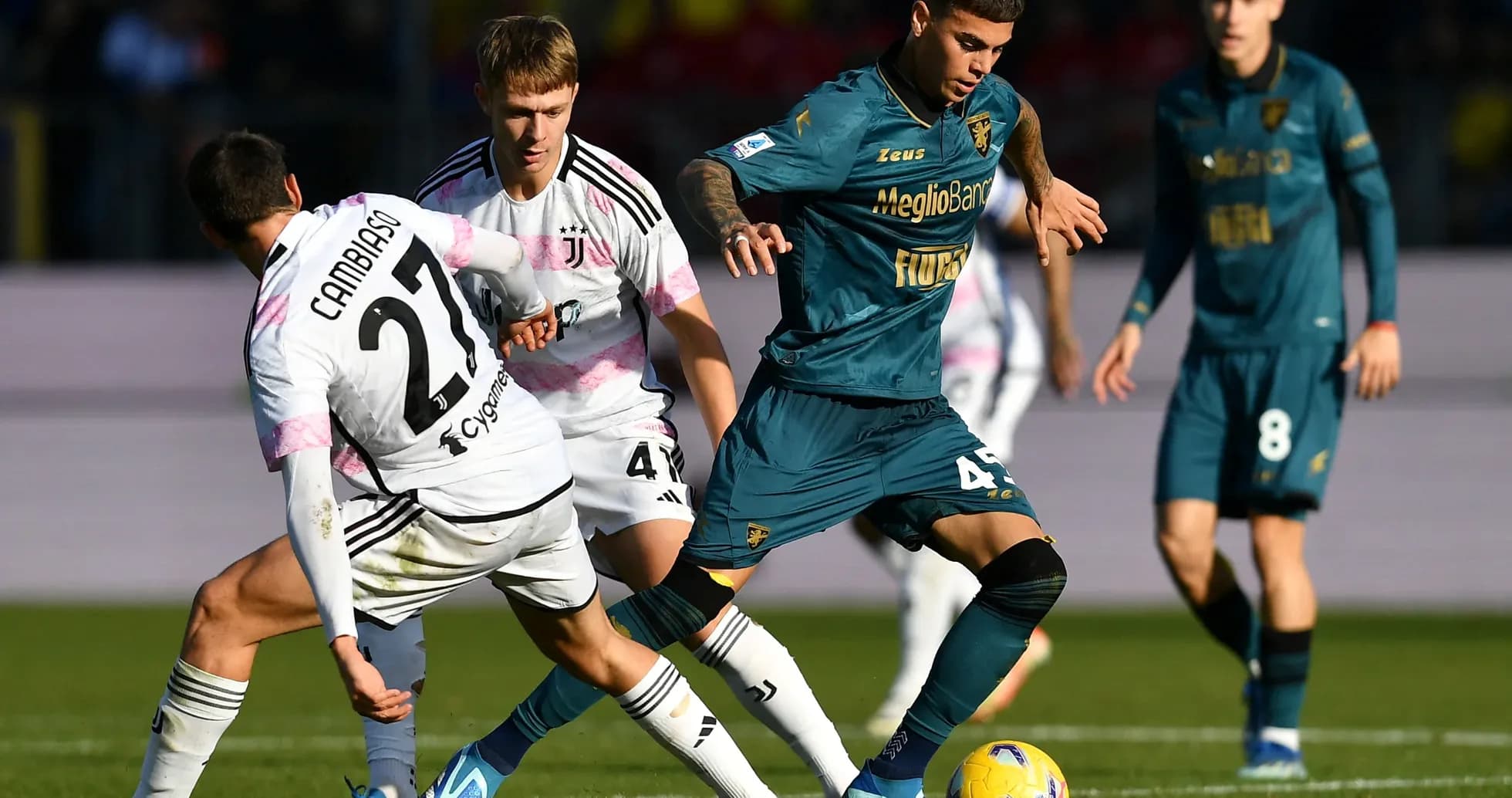 Frosinone player dribbling past Juventus defenders Frosinone player dribbling past Juventus defenders