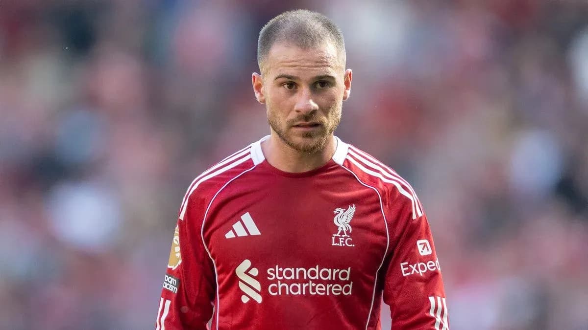 Player wearing Liverpool jersey on the field Player wearing Liverpool jersey on the field