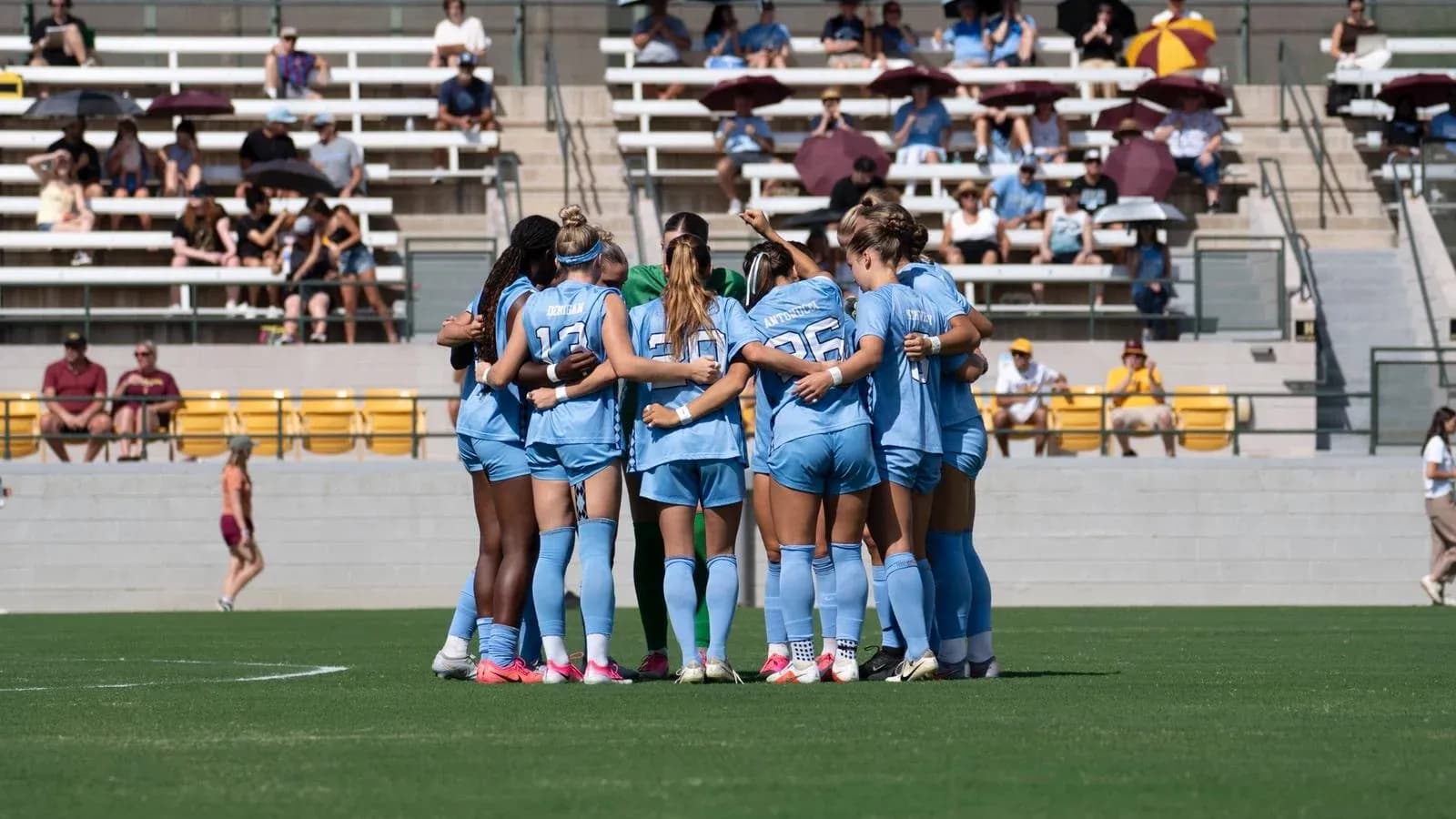 Team huddle before the match on the field Team huddle before the match on the field