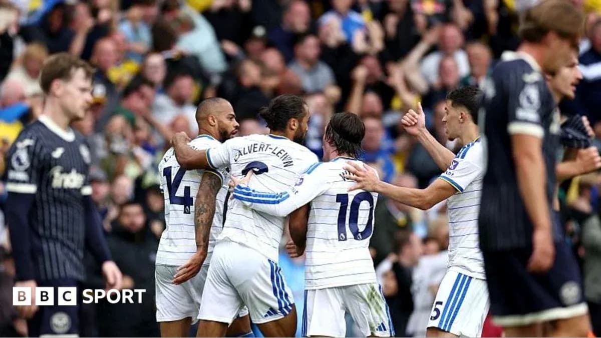 Players celebrating a goal during a football match Players celebrating a goal during a football match