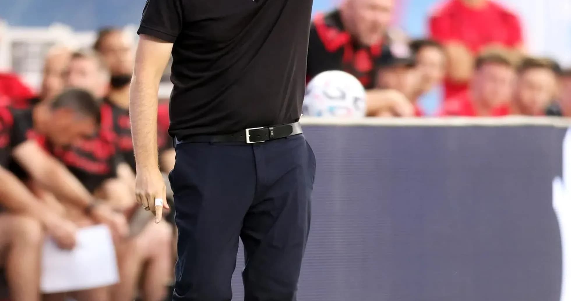 Coach giving instructions from the sidelines during match Coach giving instructions from the sidelines during match