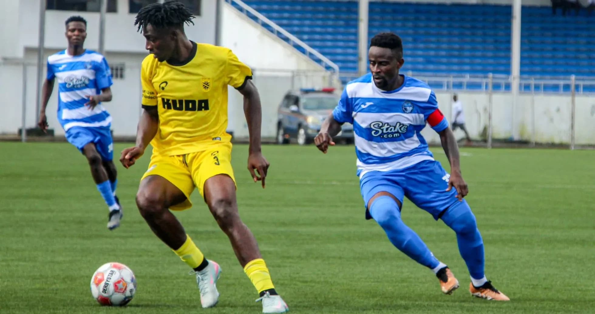 Kano Pillars player dribbling past Enyimba opponent Kano Pillars player dribbling past Enyimba opponent