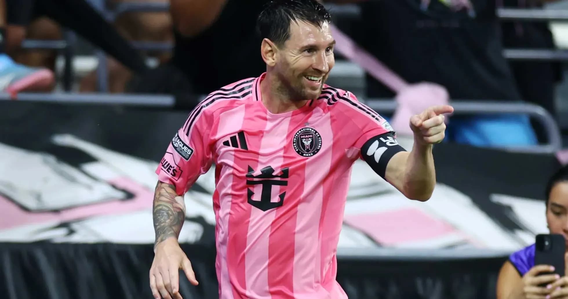 Lionel Messi celebrating in pink Inter Miami jersey Lionel Messi celebrating in pink Inter Miami jersey
