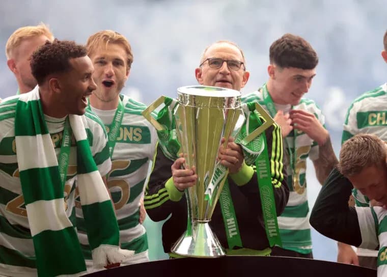 Celtic team celebrating with trophy after victory Celtic team celebrating with trophy after victory