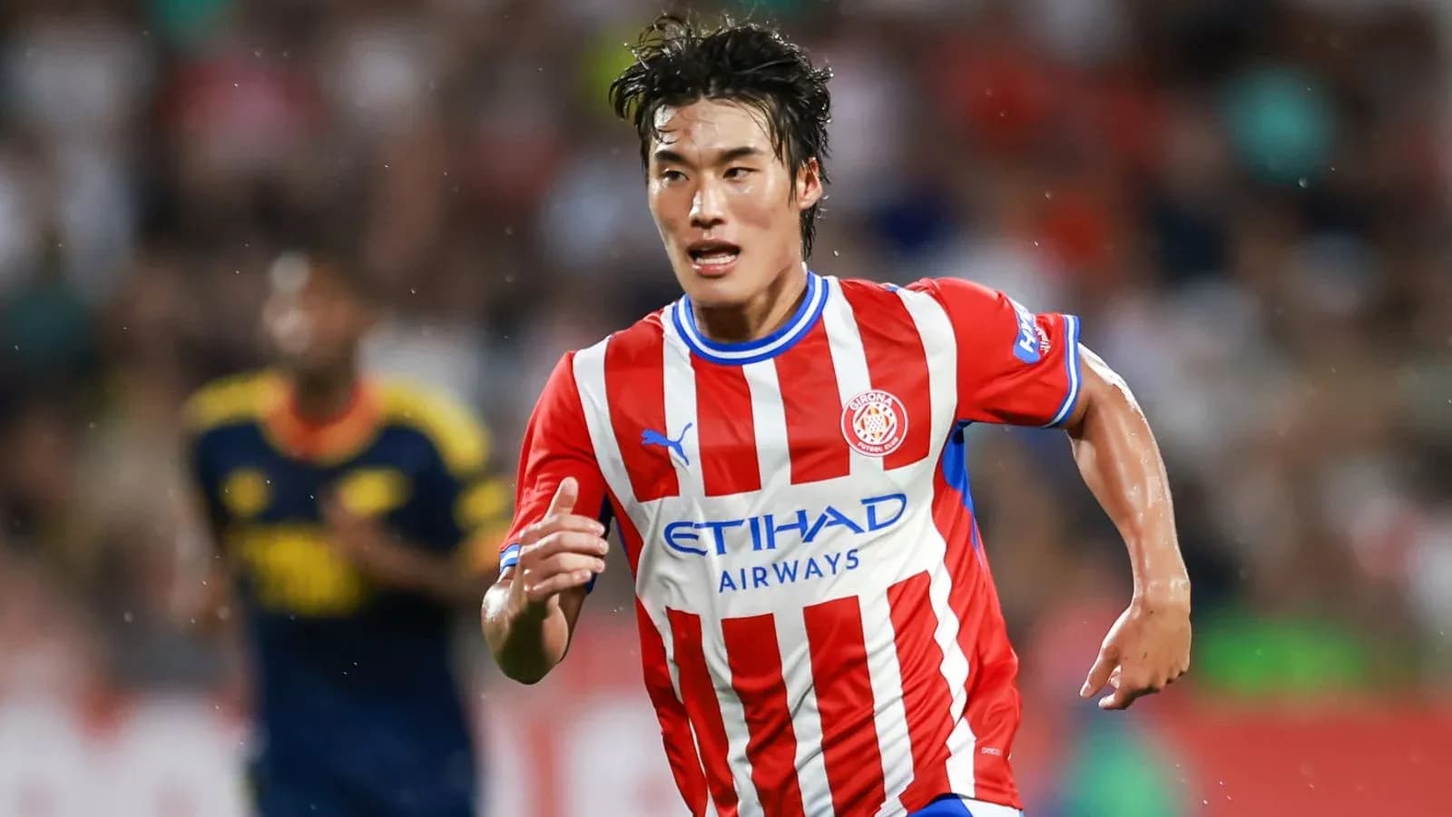 Player running with ball during a match Player running with ball during a match
