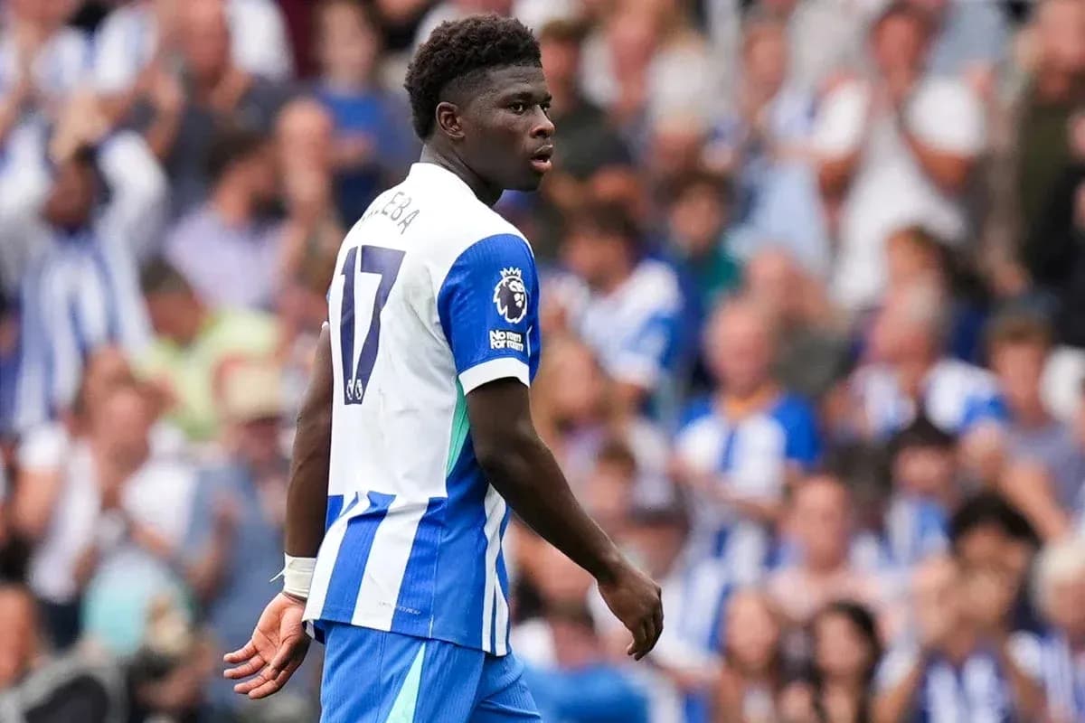 Player in blue and white kit during match Player in blue and white kit during match