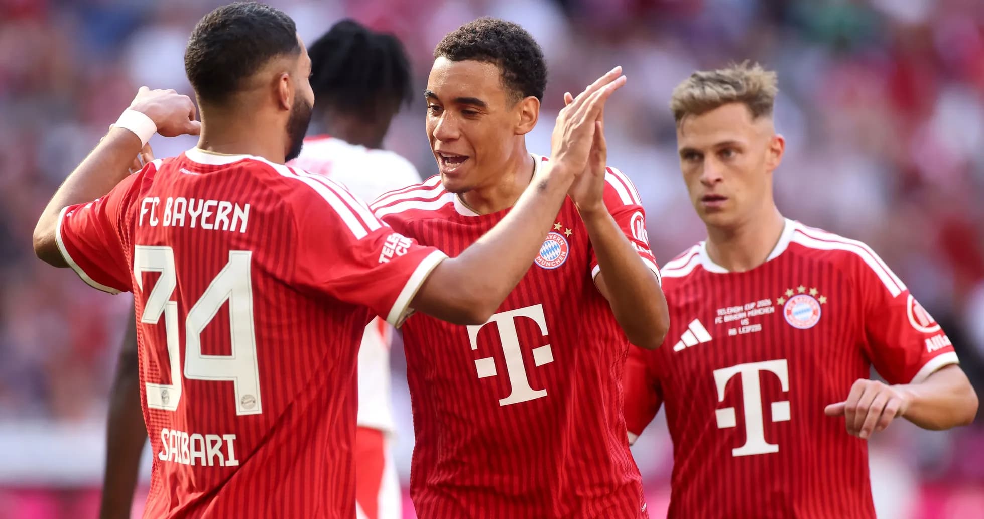 Bayern Munich players celebrating a goal together Bayern Munich players celebrating a goal together