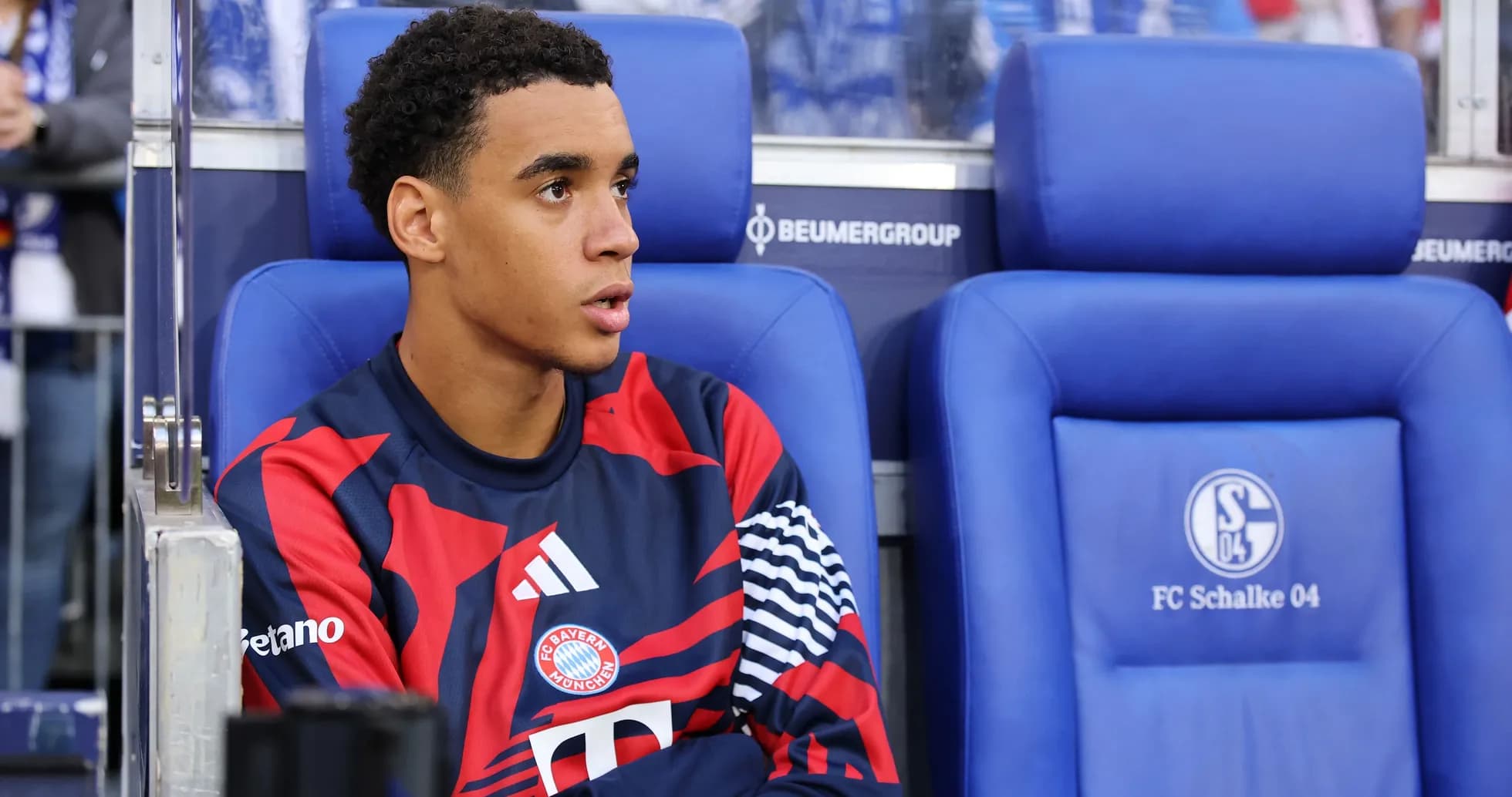Player sitting on bench during match at stadium Player sitting on bench during match at stadium