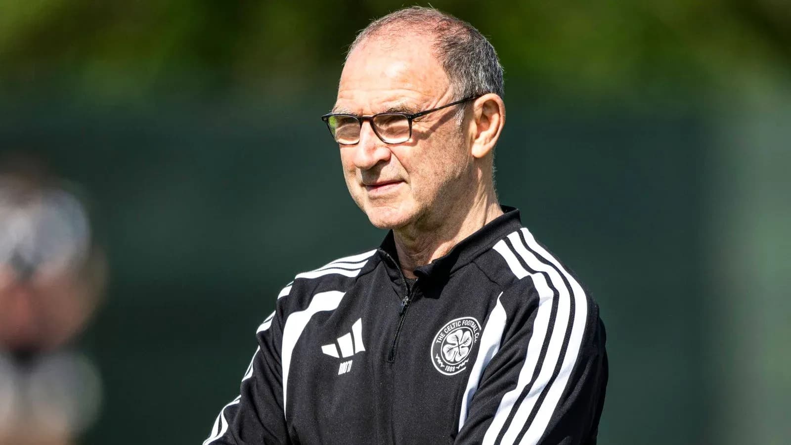 Manager observing players during training session Manager observing players during training session