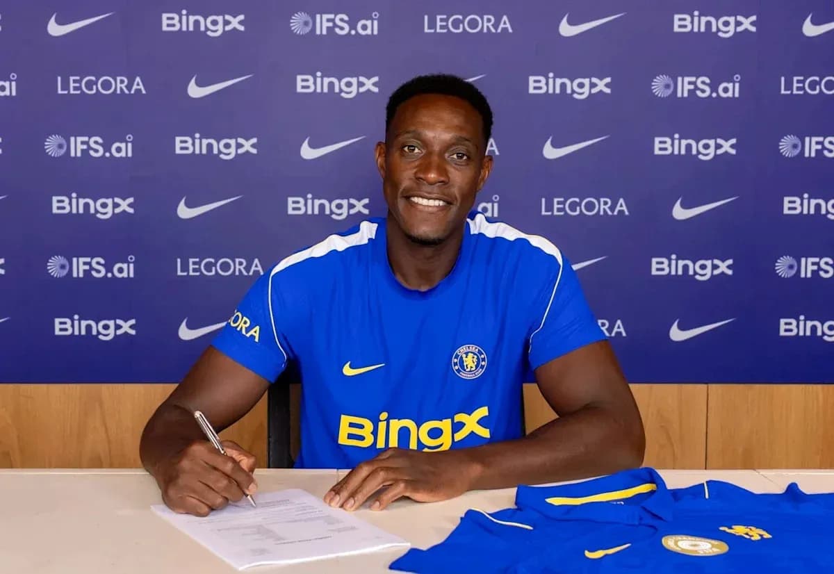 Player signing contract at press conference table Player signing contract at press conference table