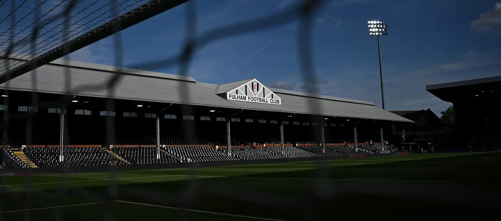 Fulham Football Club stadium with goal net in foreground Fulham Football Club stadium with goal net in foreground
