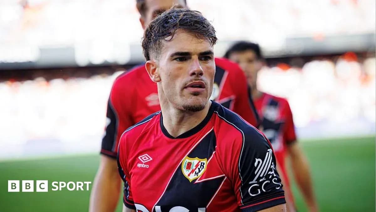 Player in Rayo Vallecano kit on the pitch Player in Rayo Vallecano kit on the pitch