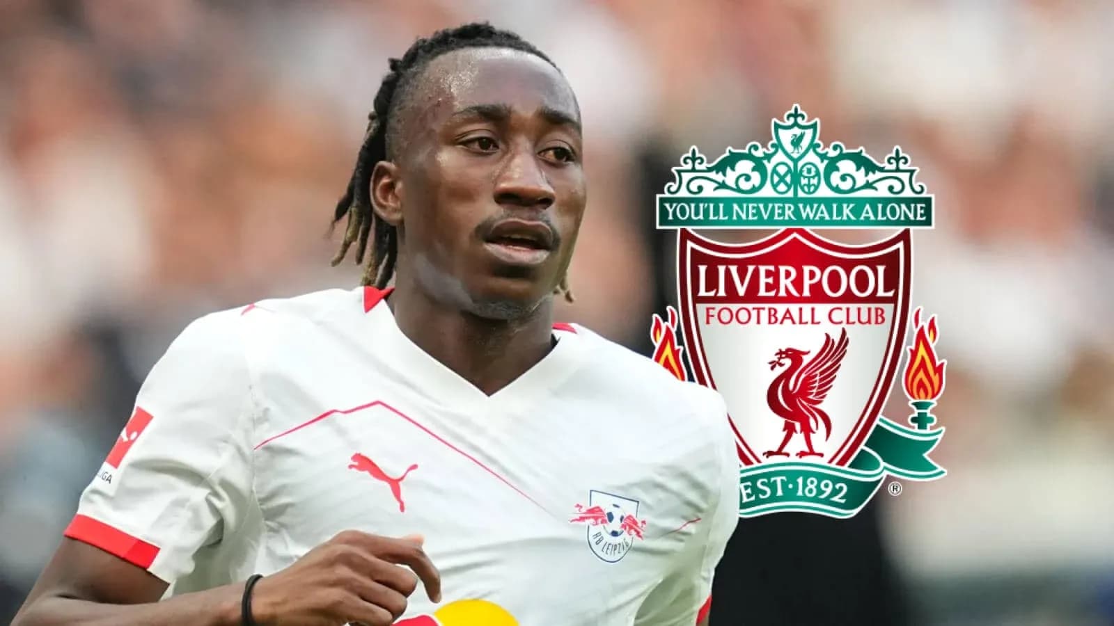 Player in action with Liverpool logo in background Player in action with Liverpool logo in background