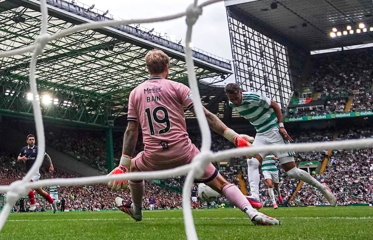 Celtic player attempting to score past goalkeeper Bain Celtic player attempting to score past goalkeeper Bain