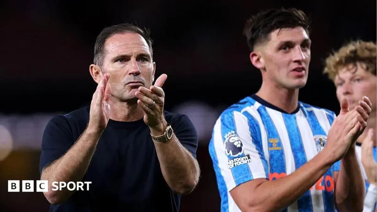 Manager and player applauding fans after match Manager and player applauding fans after match