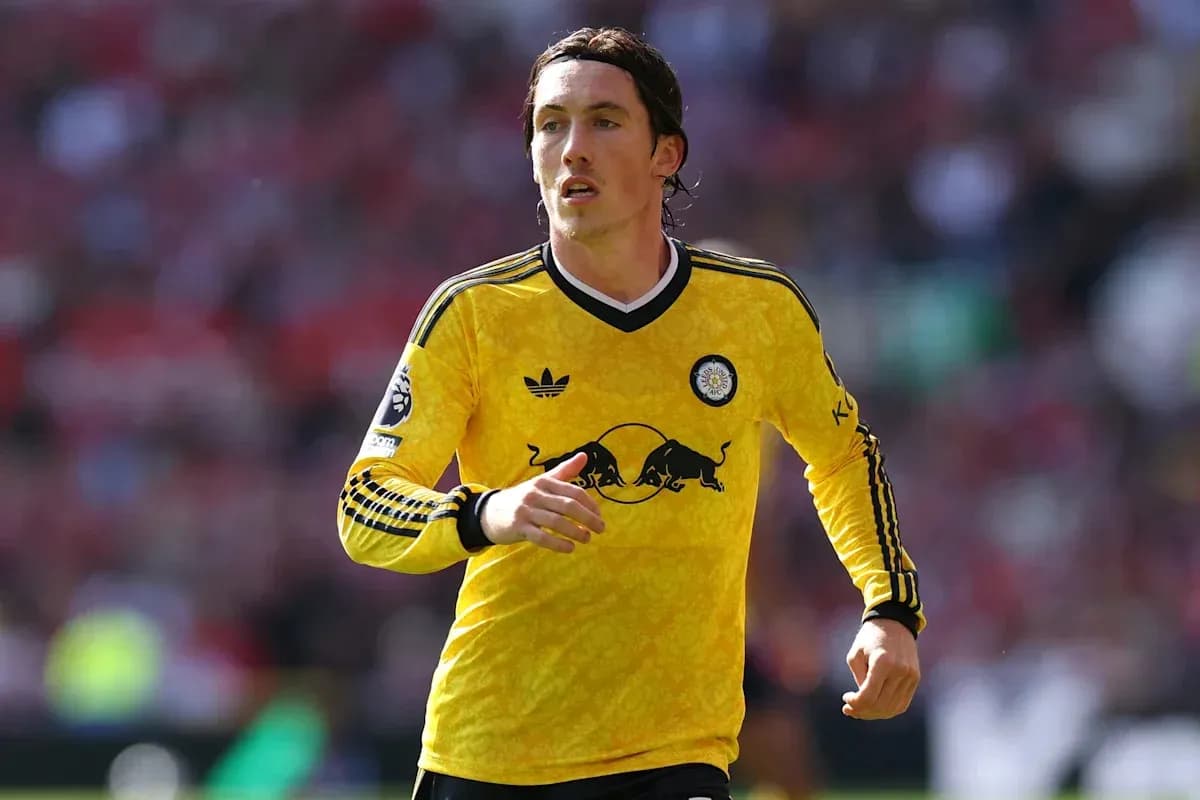 Player running in yellow kit during match Player running in yellow kit during match