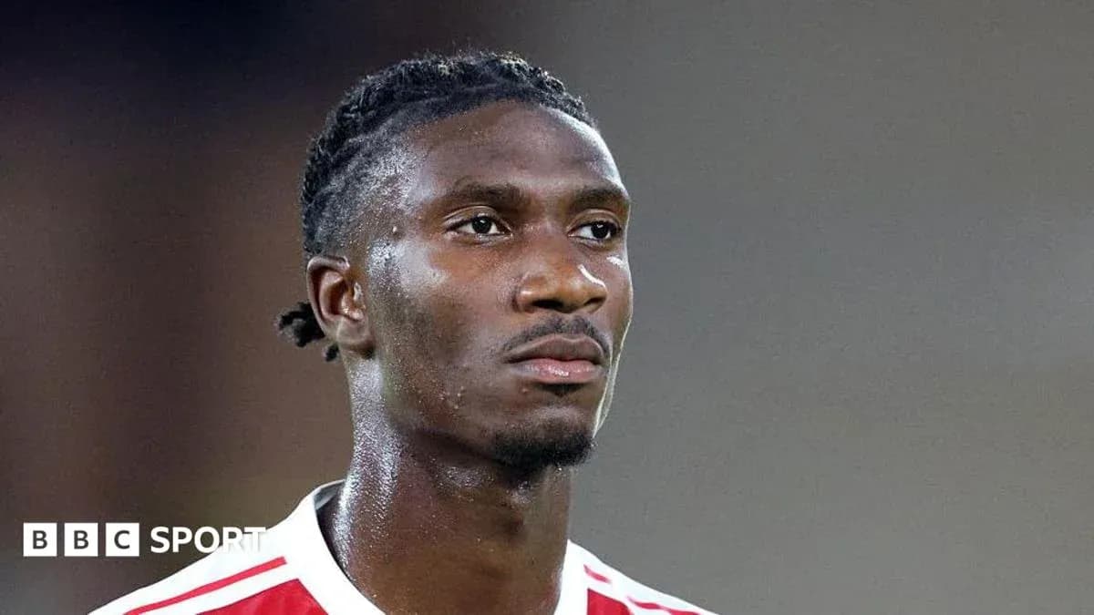 Player wearing red and white kit during match Player wearing red and white kit during match