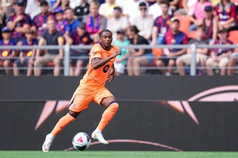 Player running with the ball during a match Player running with the ball during a match
