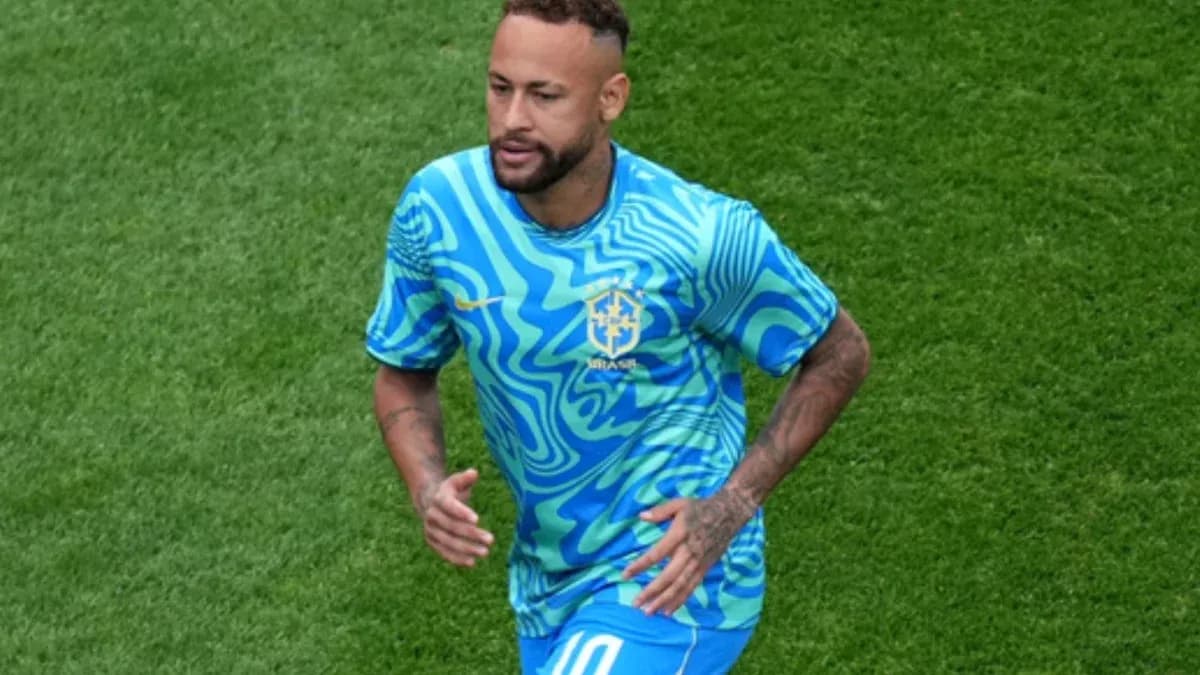 Player in blue Brazil jersey running on field Player in blue Brazil jersey running on field