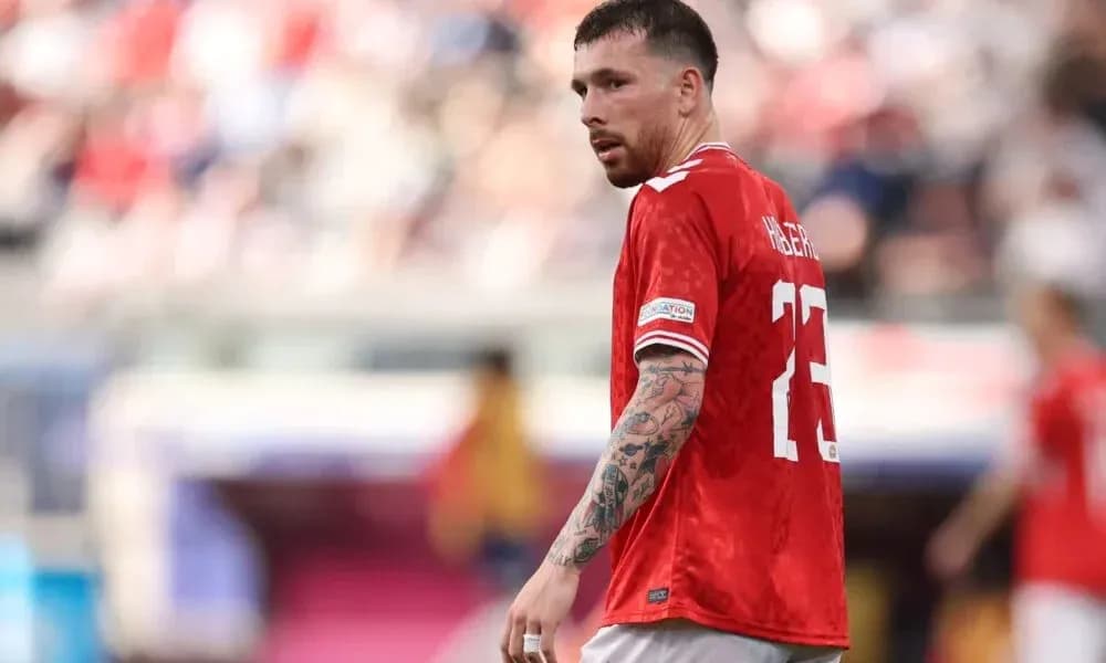 Player wearing red jersey during match action Player wearing red jersey during match action