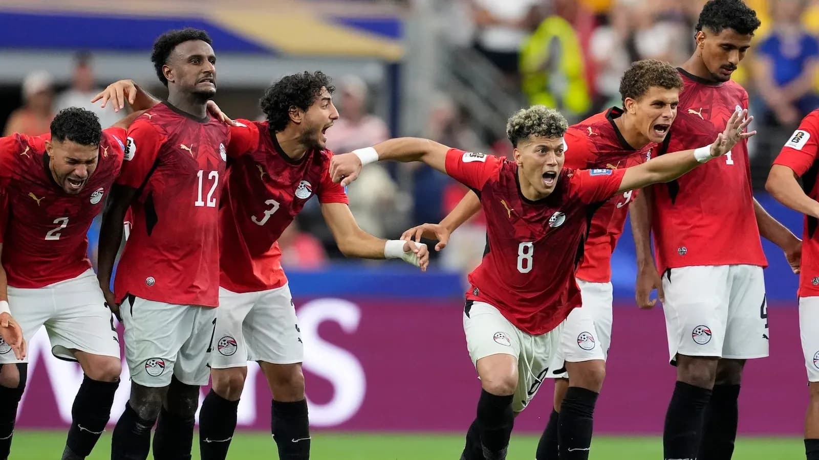 Egyptian players celebrating during a football match Egyptian players celebrating during a football match