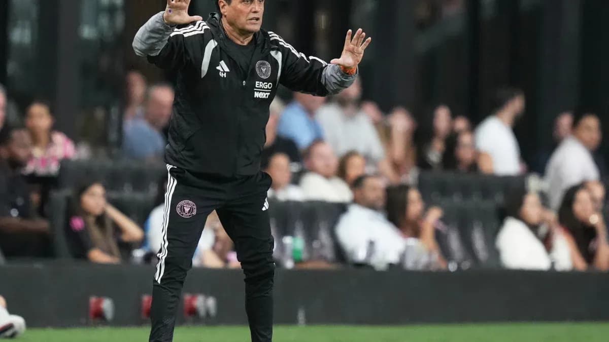 Coach gesturing during a match on the sideline Coach gesturing during a match on the sideline