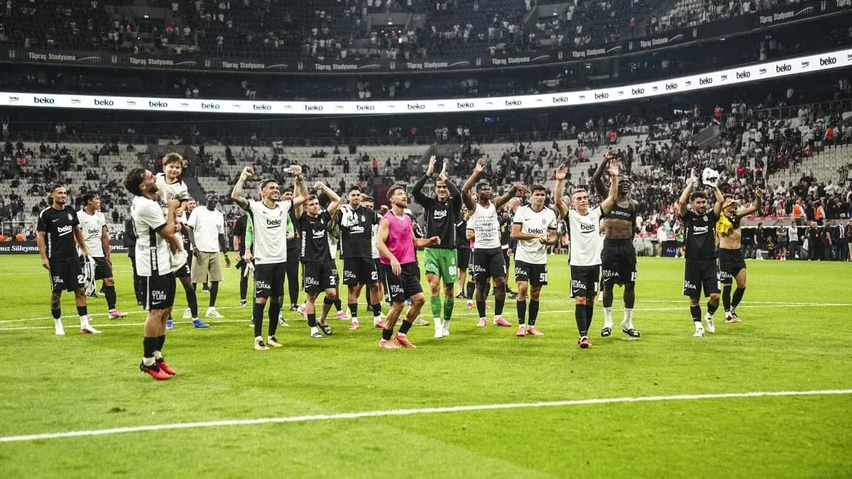 Beşiktaş players celebrating victory on the pitch Beşiktaş players celebrating victory on the pitch