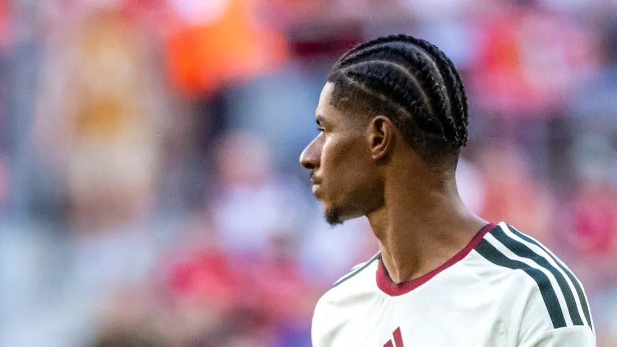 Player with braided hair during warm-up on field Player with braided hair during warm-up on field