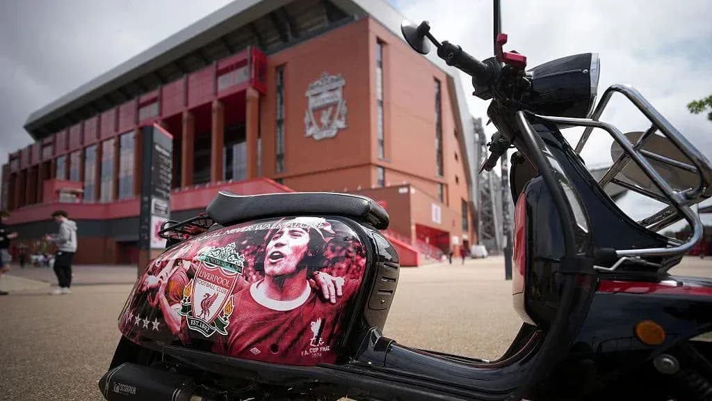 Scooter with Liverpool FC mural outside stadium Scooter with Liverpool FC mural outside stadium