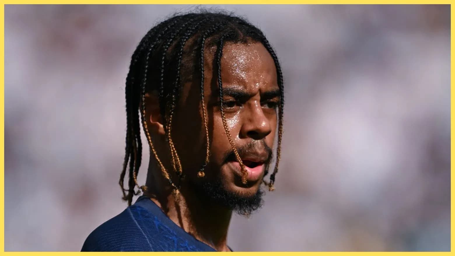 Player with braids during a match Player with braids during a match