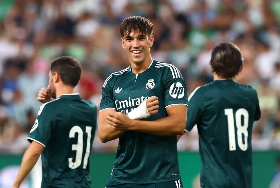 Real Madrid players celebrating during a match Real Madrid players celebrating during a match