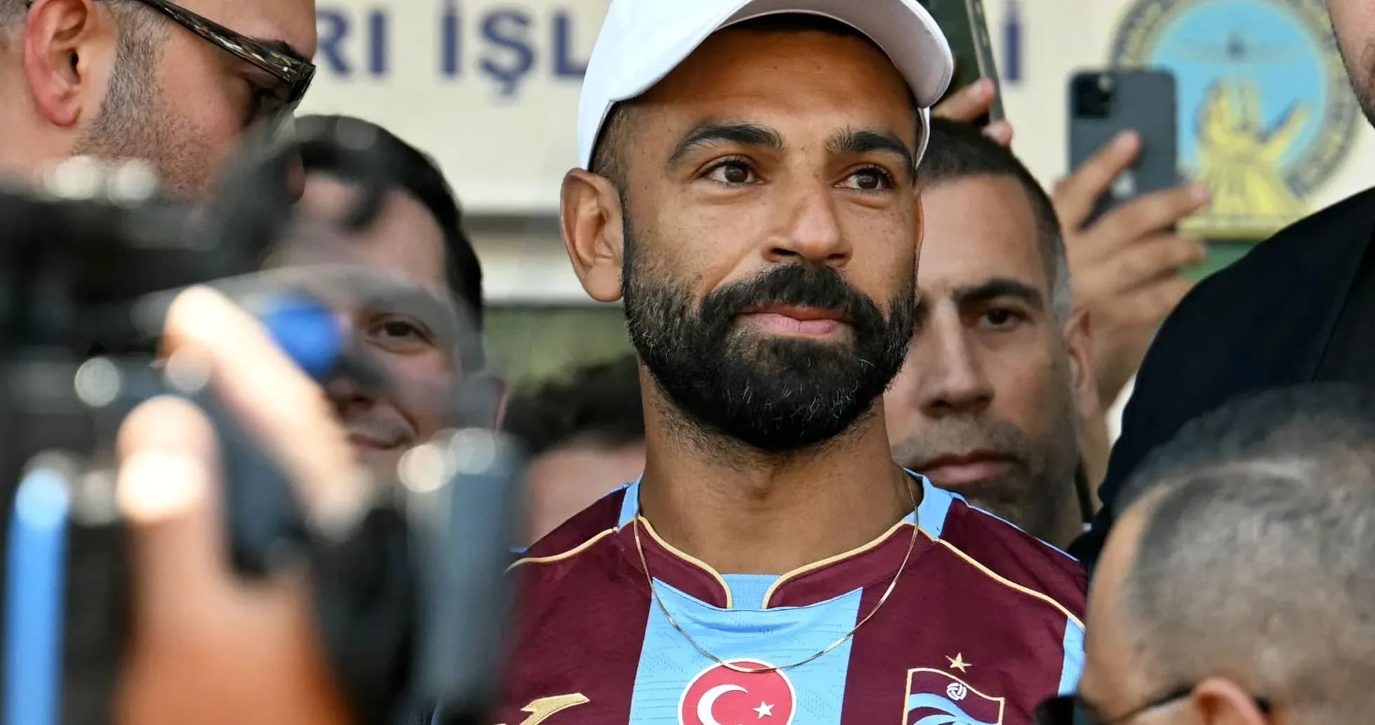 Football player in Trabzonspor jersey at event Football player in Trabzonspor jersey at event