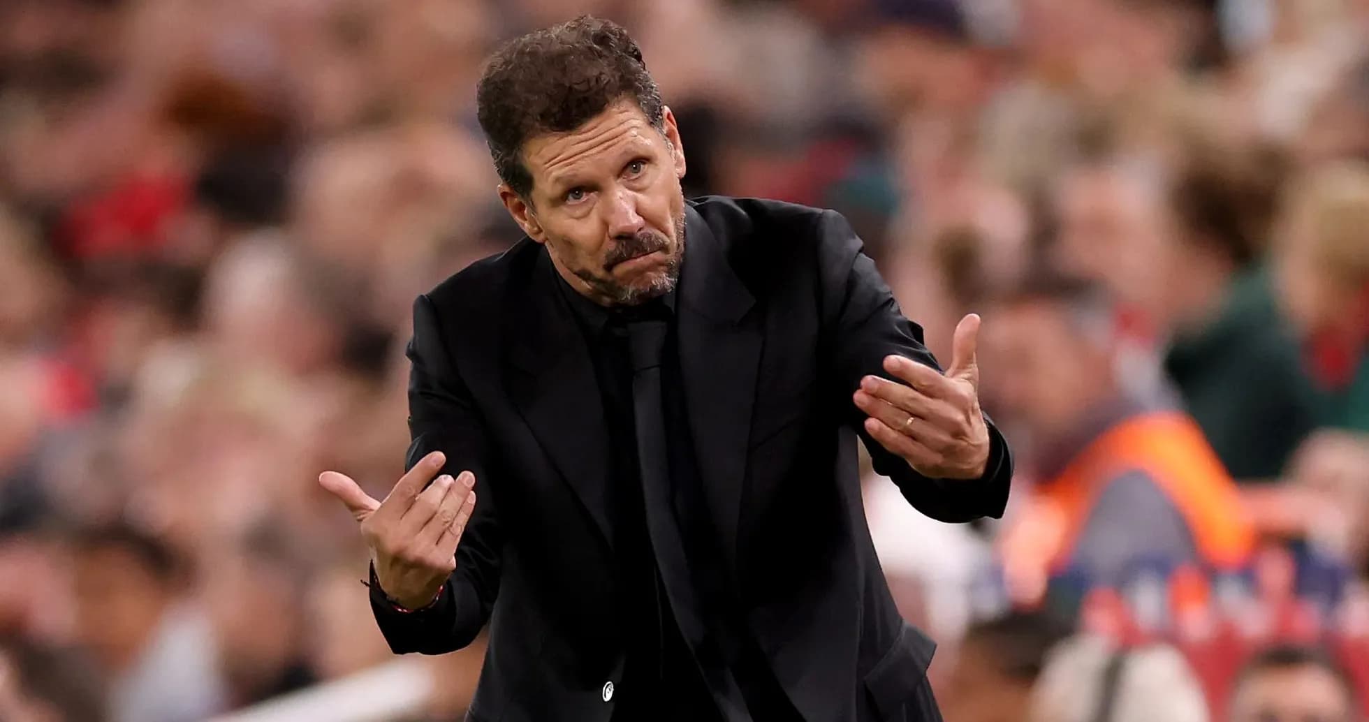 Manager gesturing during a match on the sideline Manager gesturing during a match on the sideline