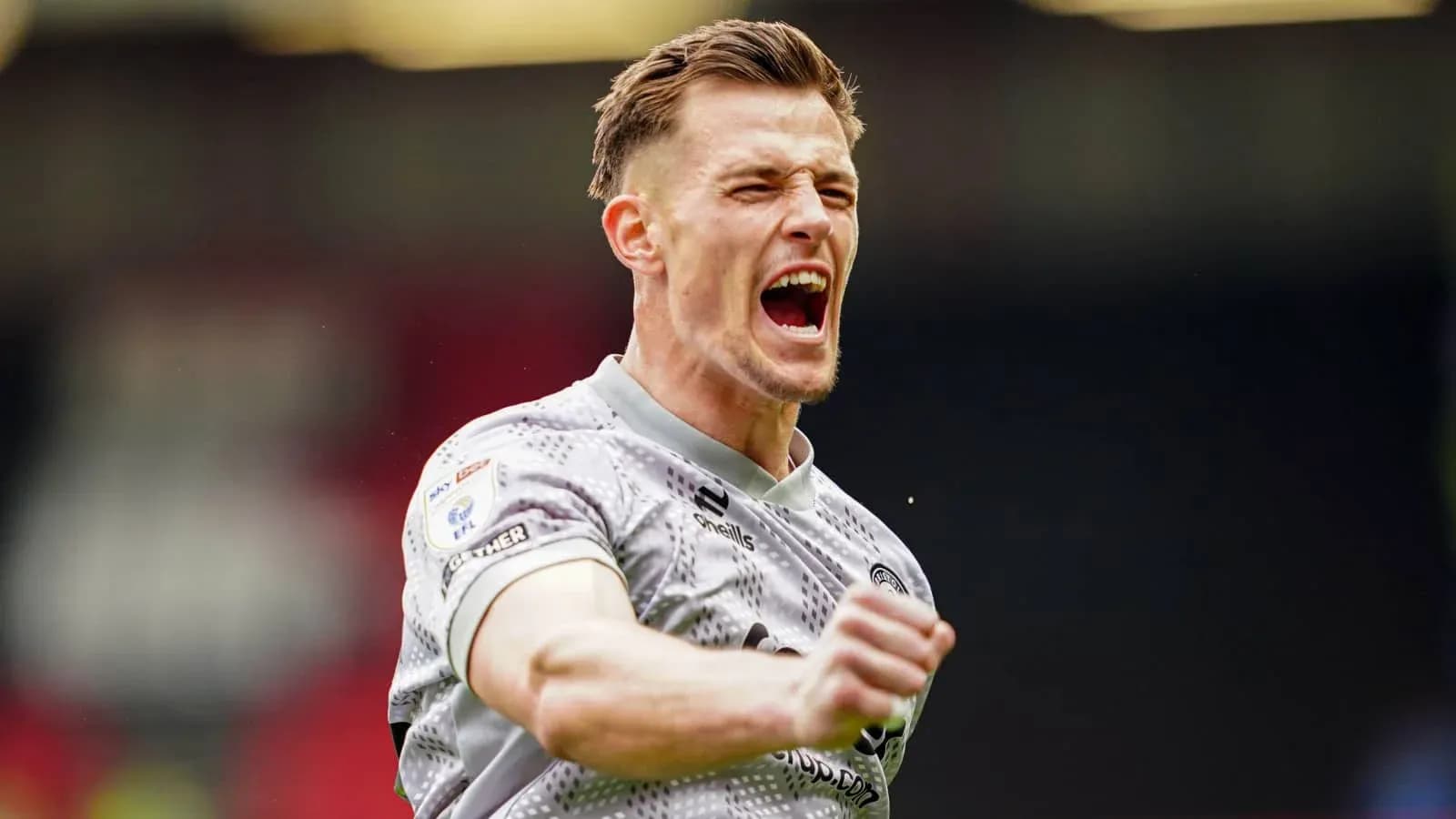 Player celebrating passionately after a match Player celebrating passionately after a match