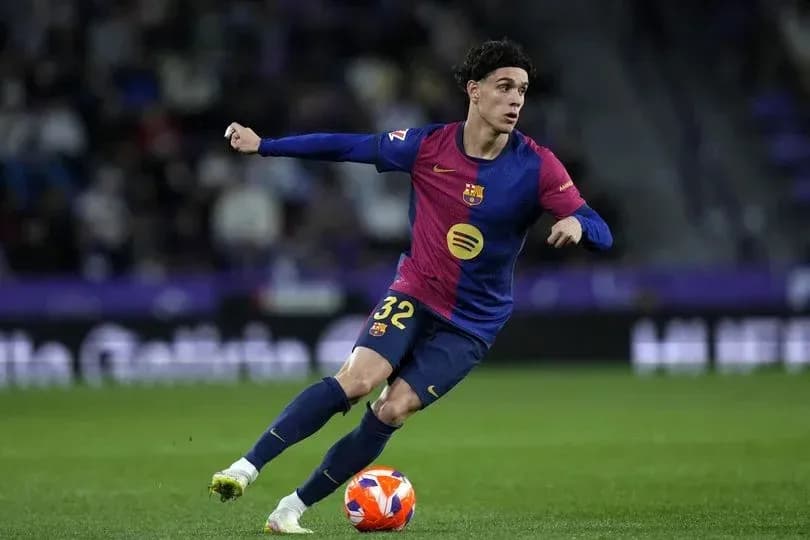 Barcelona player dribbling ball during match Barcelona player dribbling ball during match