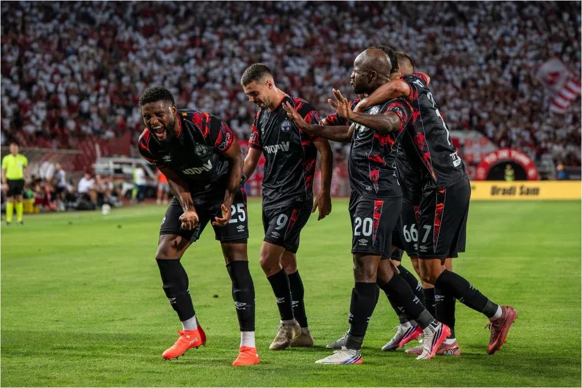 Players celebrating a goal during the match Players celebrating a goal during the match