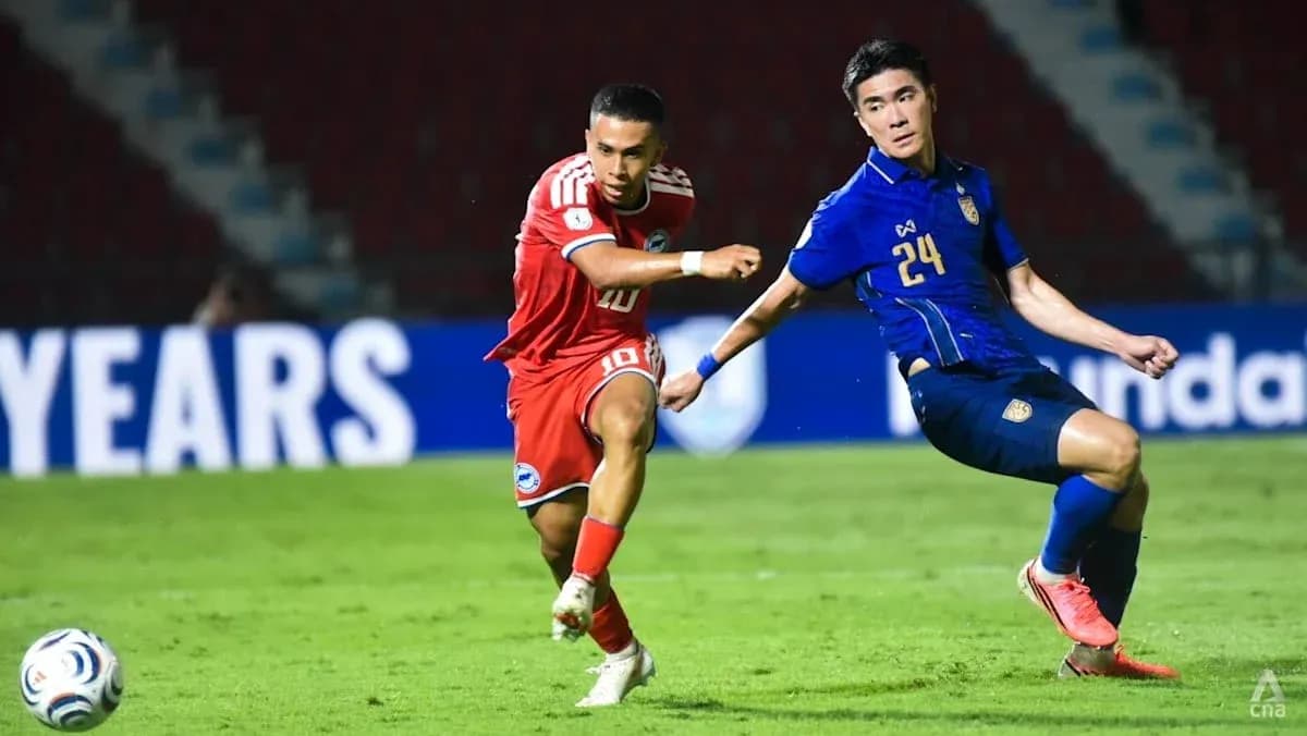 Player 10 dribbling past Player 24 during match Player 10 dribbling past Player 24 during match