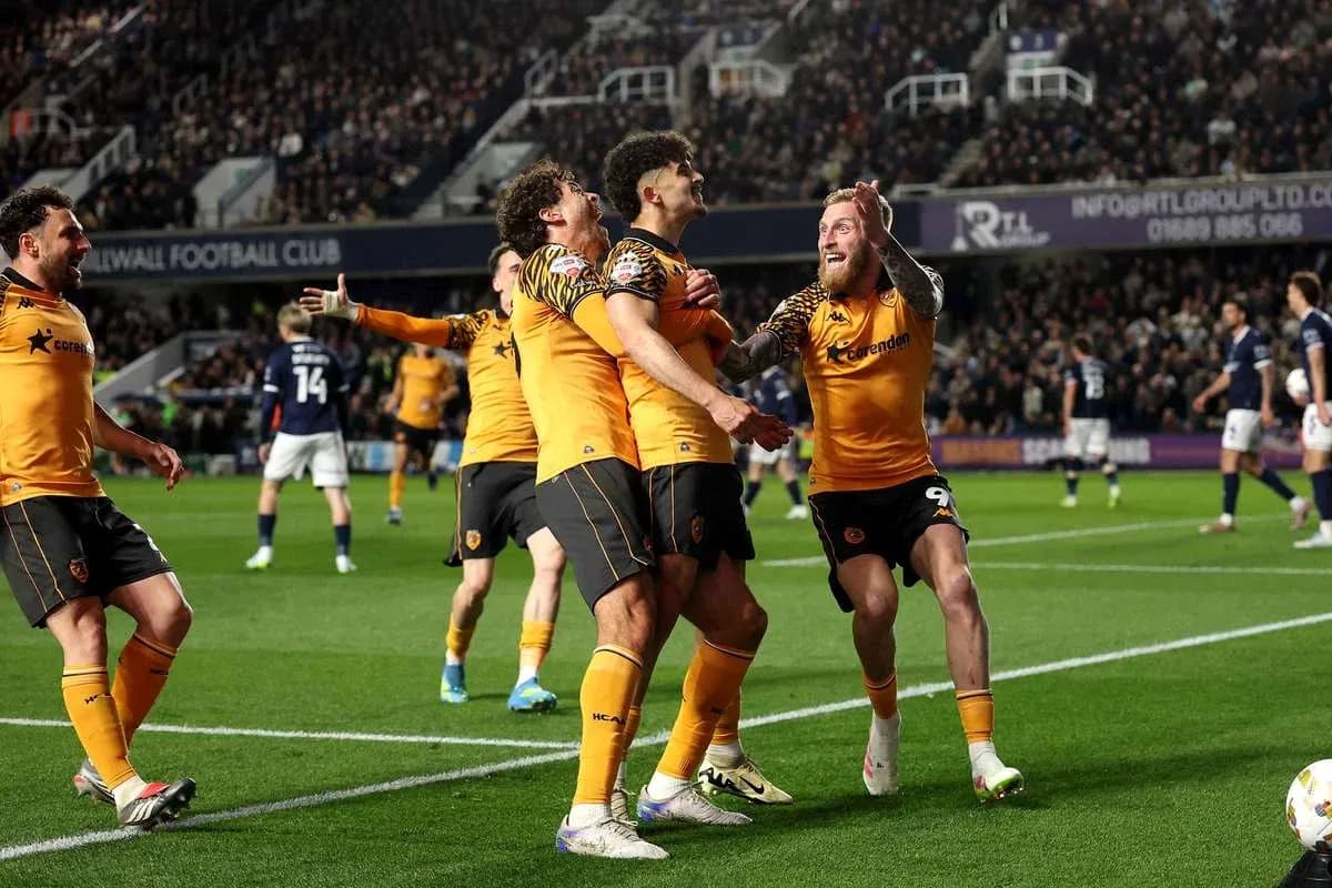 Wolverhampton players celebrating a goal on the pitch Wolverhampton players celebrating a goal on the pitch