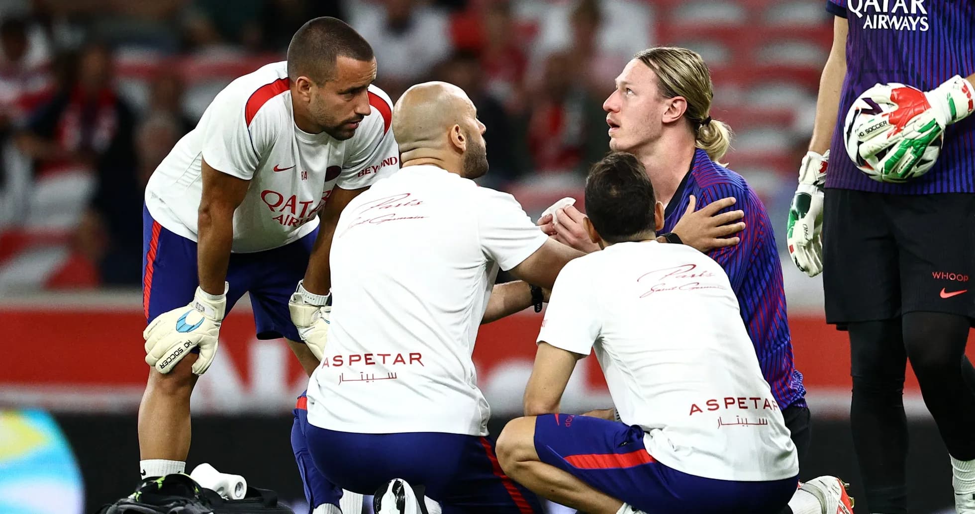 Medical staff attending to player on the field Medical staff attending to player on the field