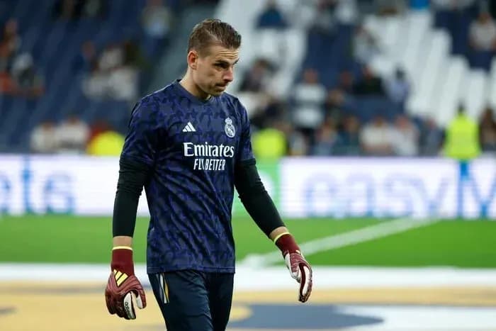 Goalkeeper walking off the field after match Goalkeeper walking off the field after match
