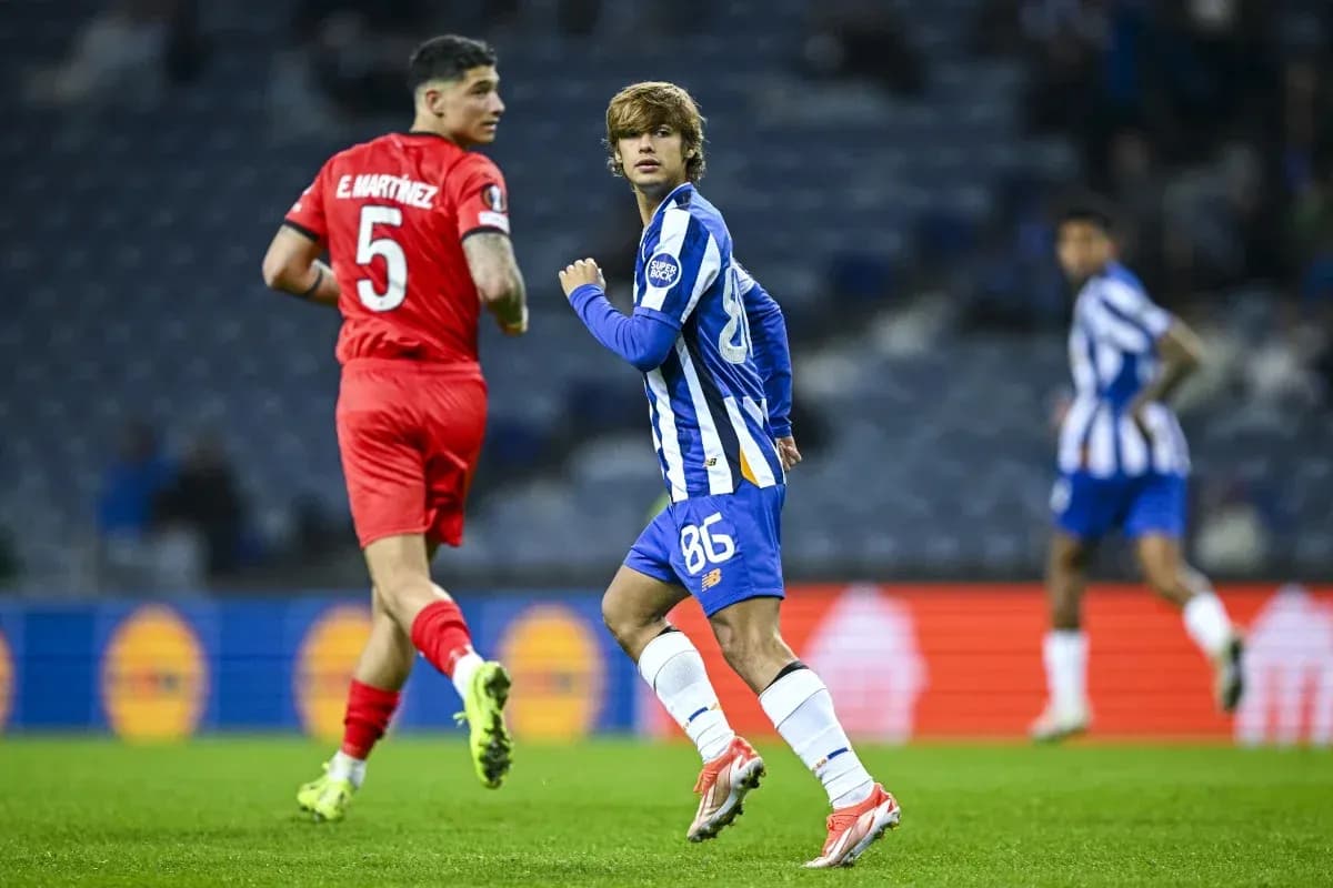 Player in blue jersey running during match Player in blue jersey running during match