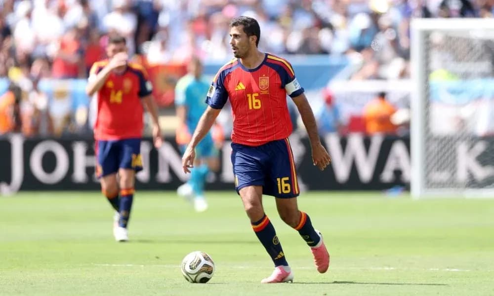 Spain player dribbling ball during match Spain player dribbling ball during match