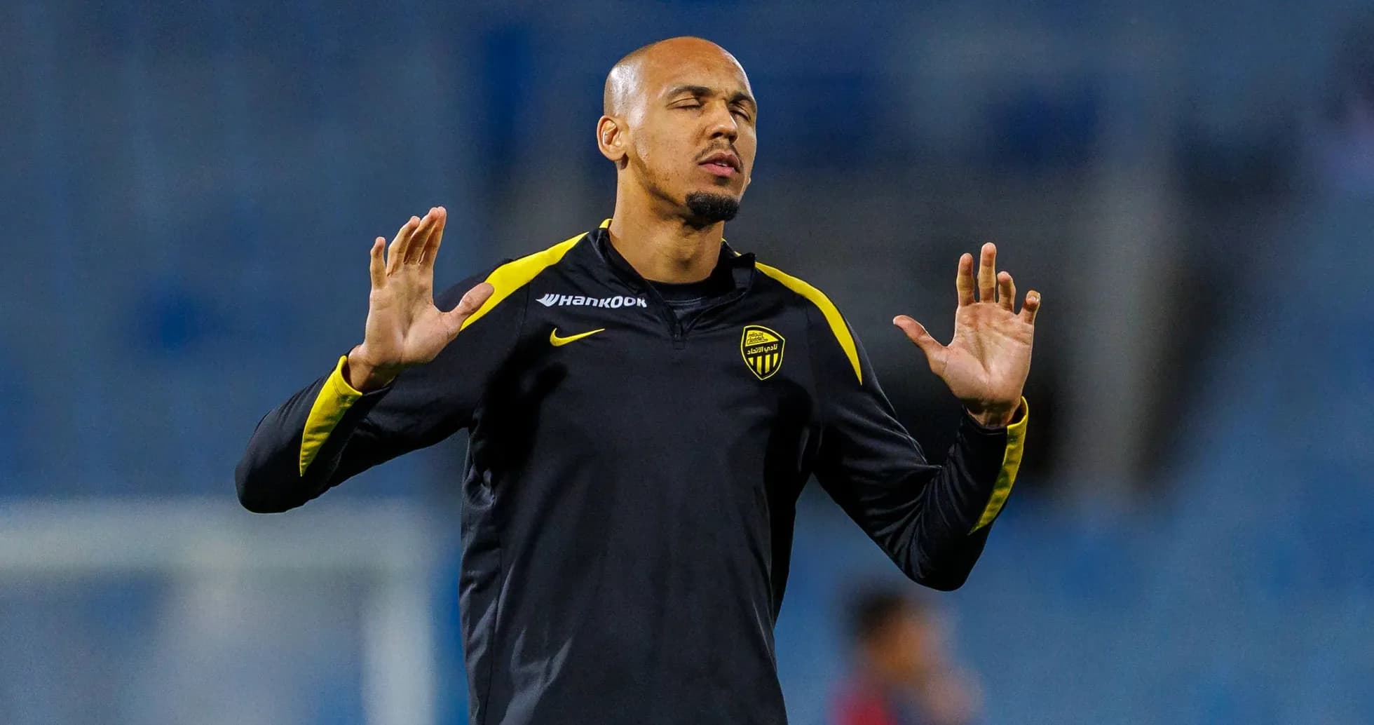 Player practicing with hands raised during training Player practicing with hands raised during training