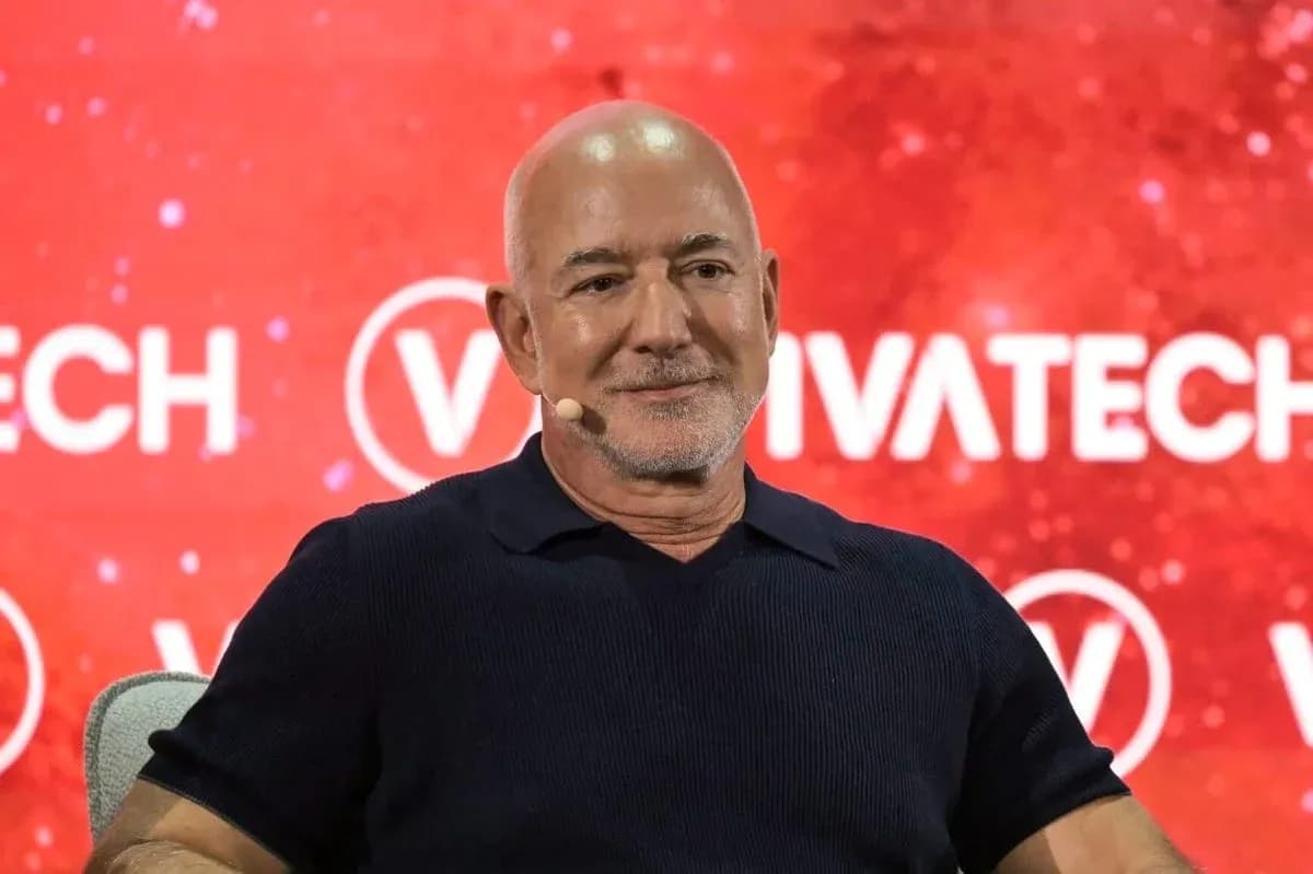 Speaker at VivaTech event with red backdrop Speaker at VivaTech event with red backdrop