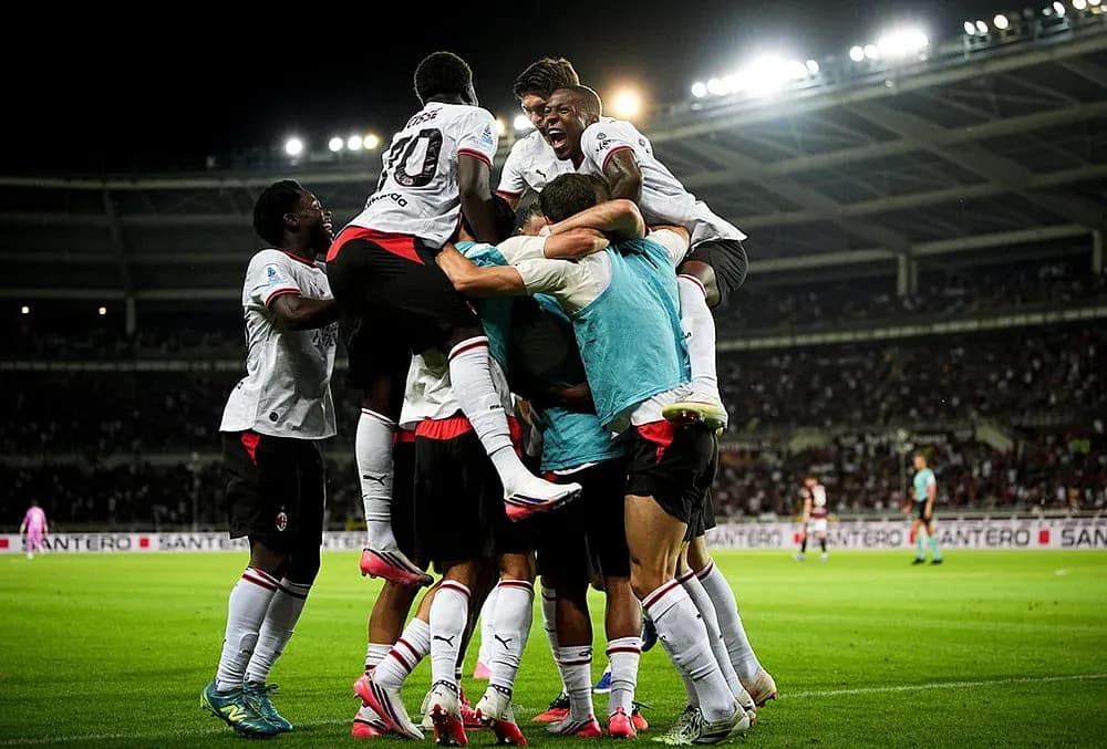 AC Milan players celebrating a goal AC Milan players celebrating a goal