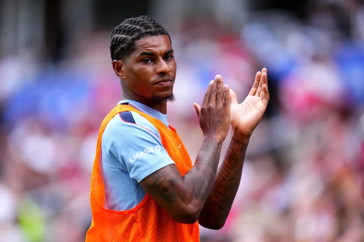Player applauding while wearing training bib on field Player applauding while wearing training bib on field