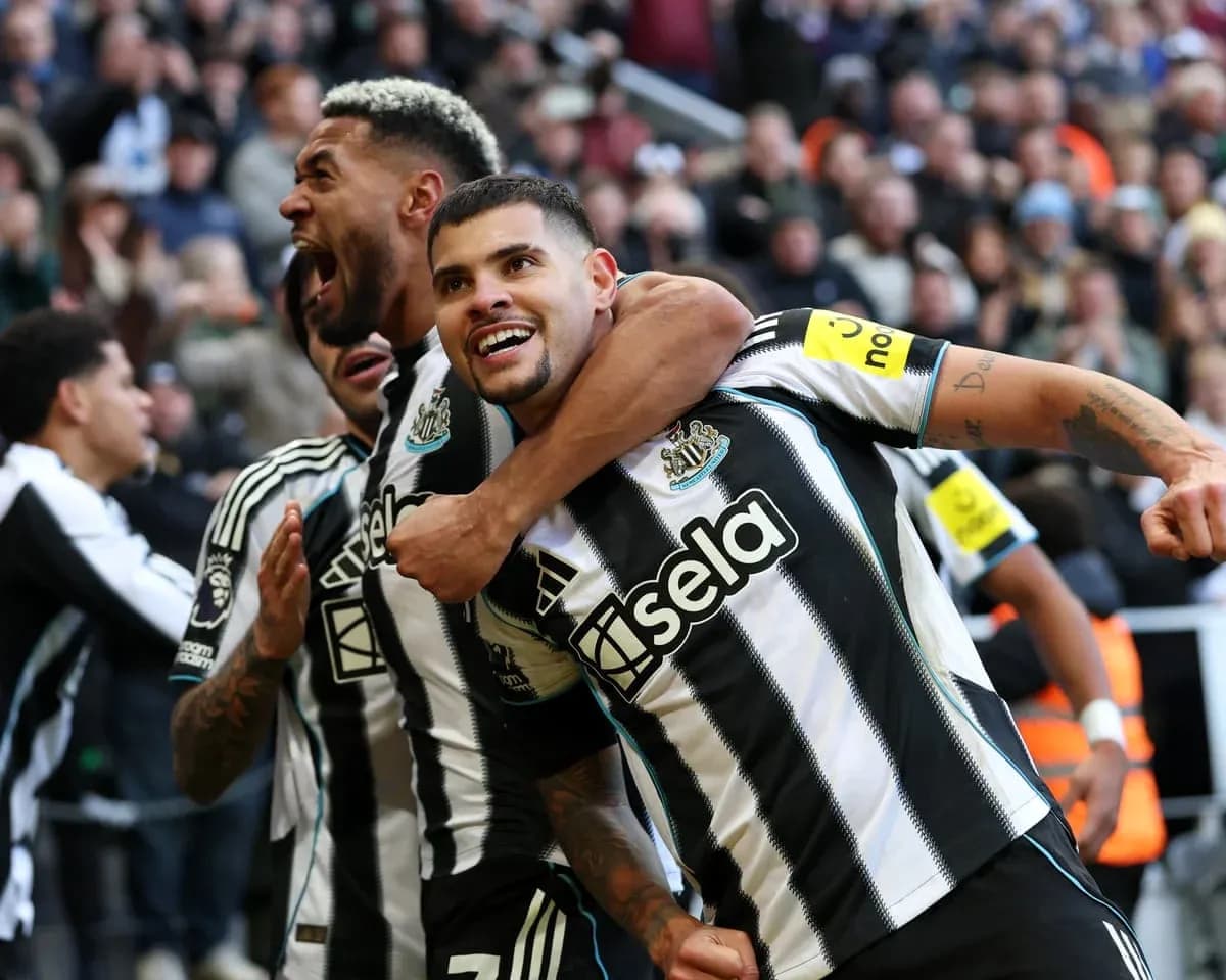Newcastle players celebrating a goal during match Newcastle players celebrating a goal during match