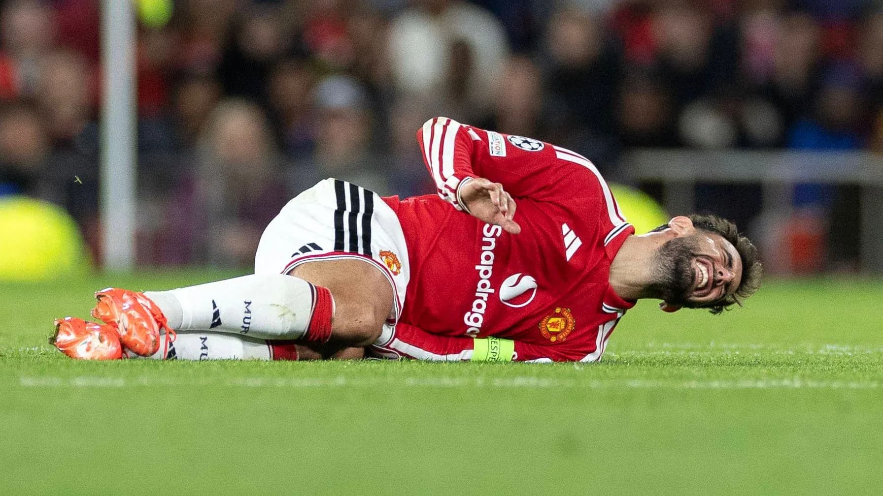 Player lying on the ground during a match Player lying on the ground during a match